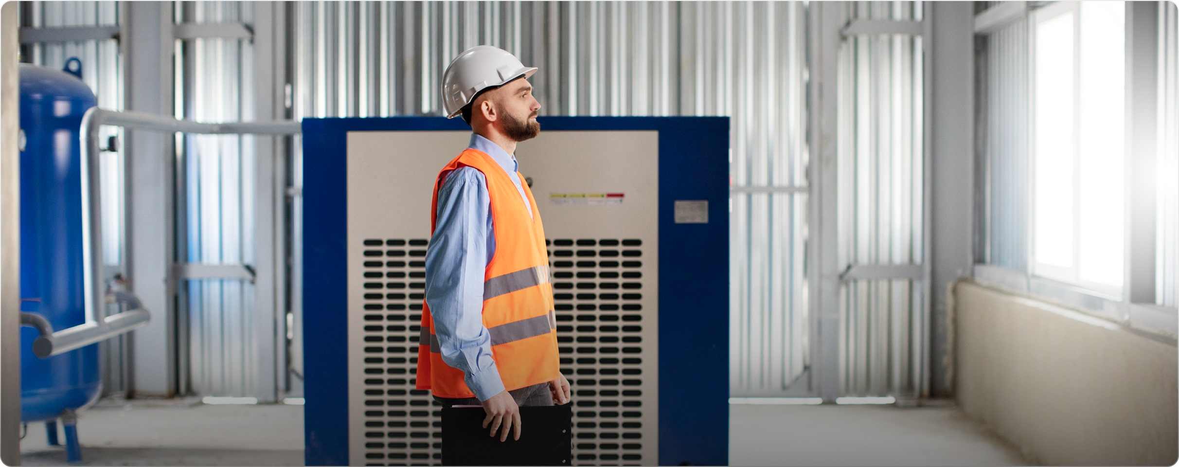 Green Thermal technician inspecting a hot water system on site